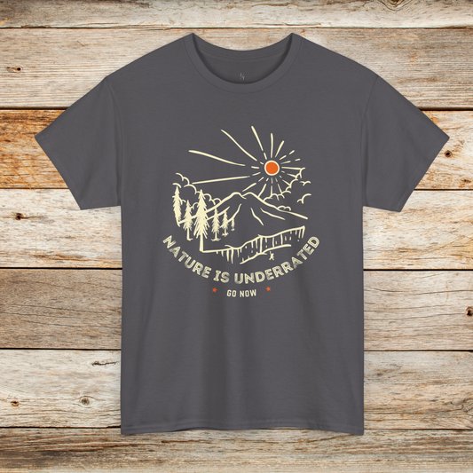 Charcoal colored tee shirt with Nature is Underrated graphic with mountains, trees and sunshine.