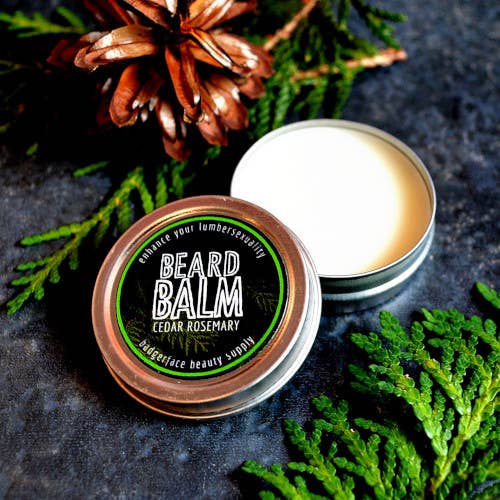 An earthy photo showing an open tin of Beard Balm.
